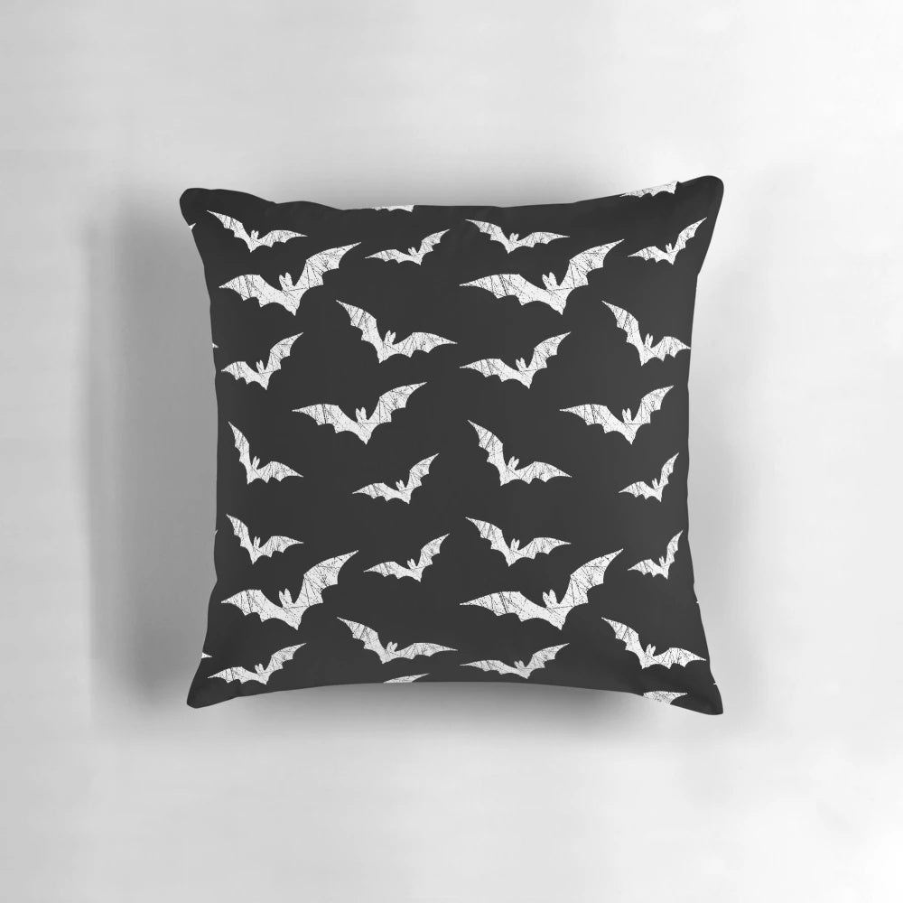 Decorative throw pillow featuring a spooky bat pattern design, perfect for adding a touch of gothic charm to any room.