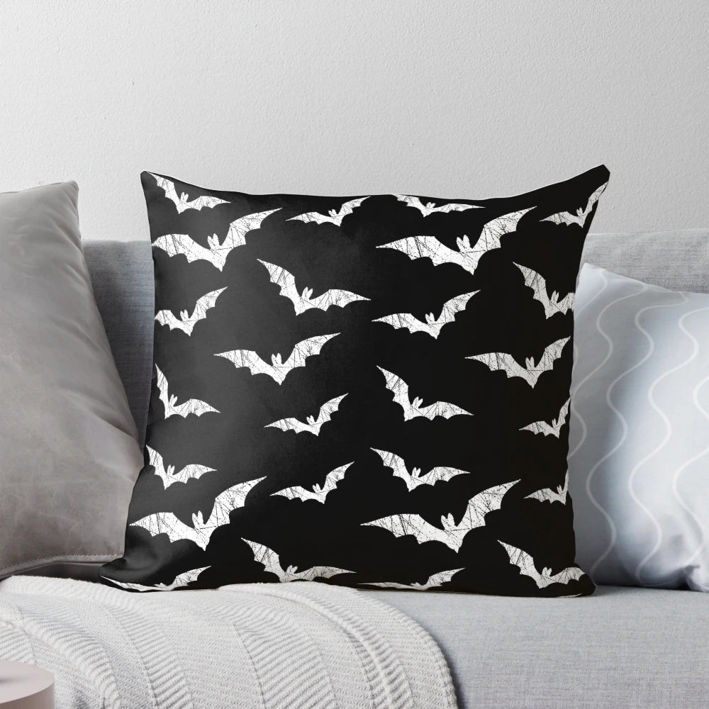 Decorative throw pillow featuring a spooky bat pattern design, perfect for adding a touch of gothic charm to any room.
