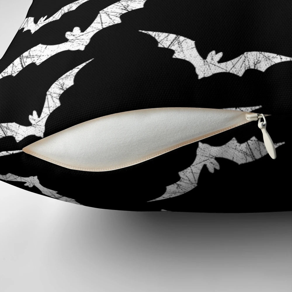 Decorative throw pillow featuring a spooky bat pattern design, perfect for adding a touch of gothic charm to any room.