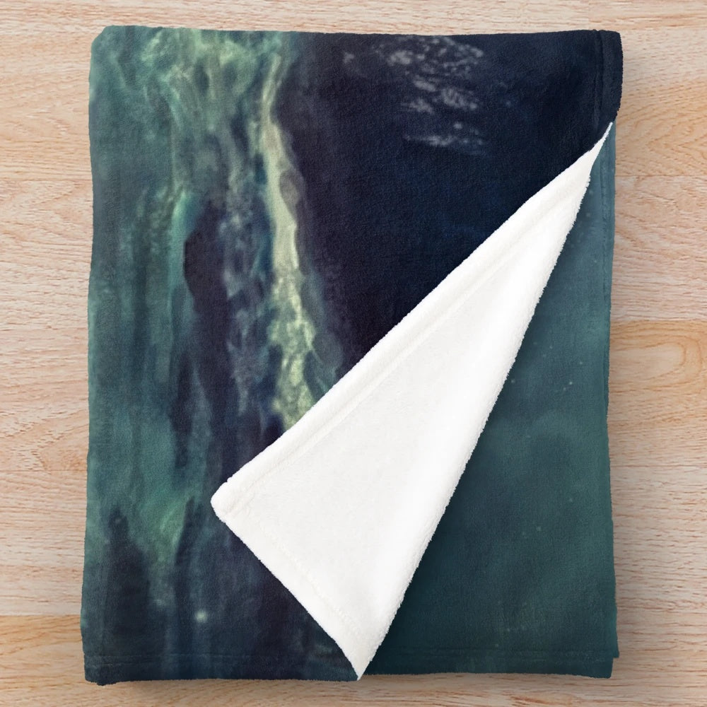 Ghost pirate ship sailing at night on a plush blanket