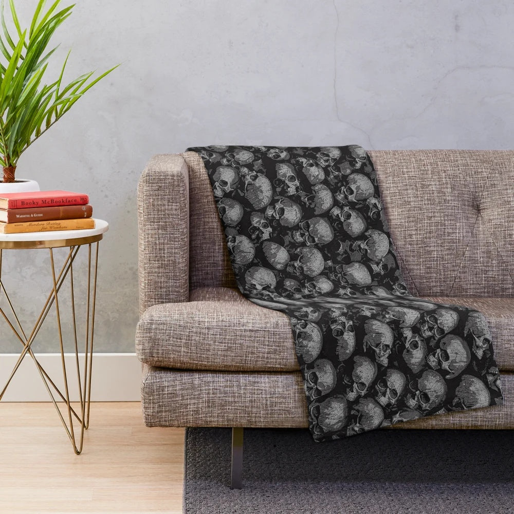 Plush Gothic-inspired blanket with a macabre skeleton pattern