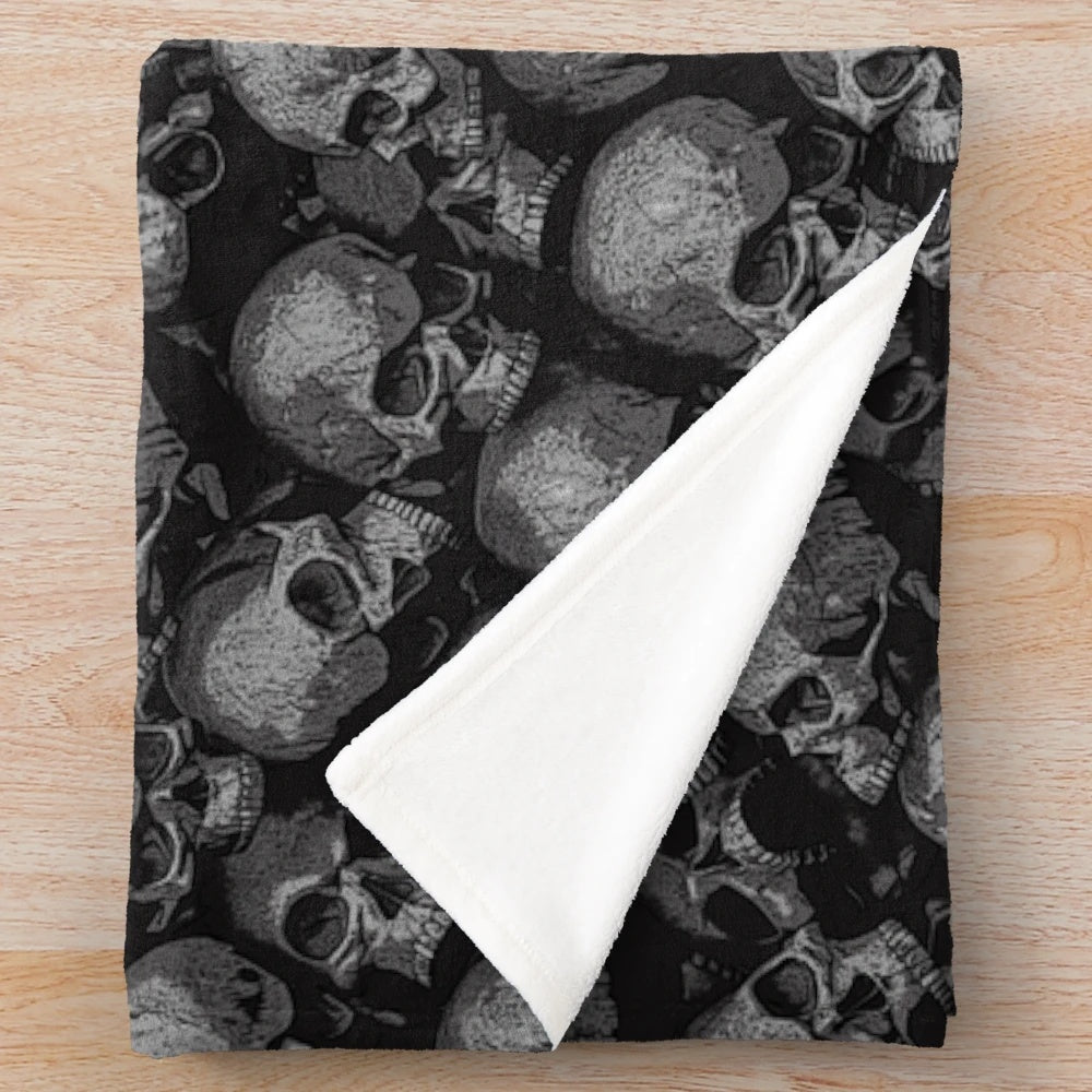 Plush Gothic-inspired blanket with a macabre skeleton pattern