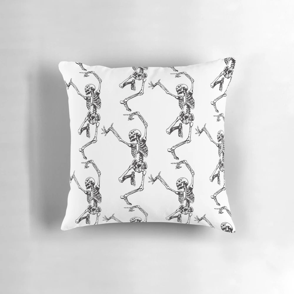 Spooky skeleton dancing in a vintage, bohemian-inspired design on a high-quality pillow