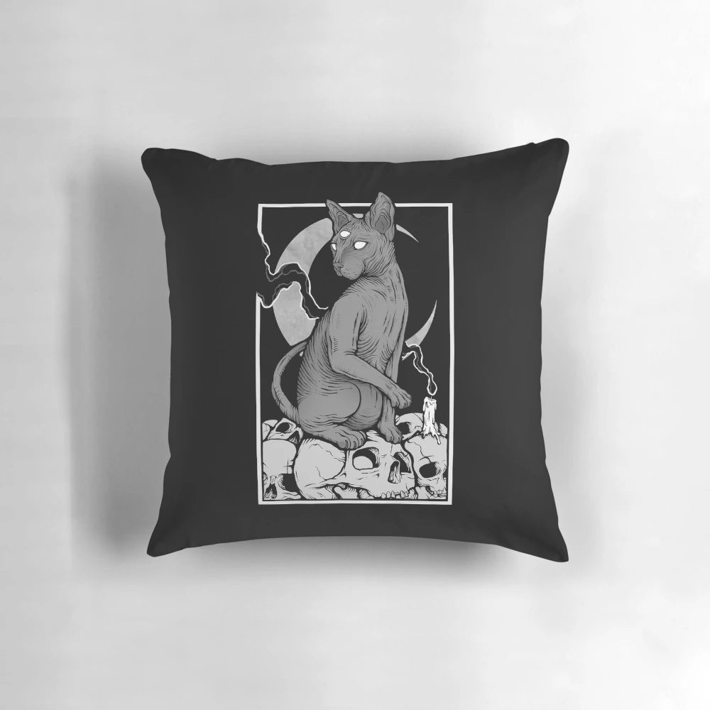 A Spooky Occult Cat Pillow with a Skull and Candle Design