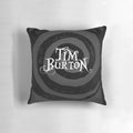 A black and white pillow featuring a gothic, minimalist design inspired by the films of Tim Burton