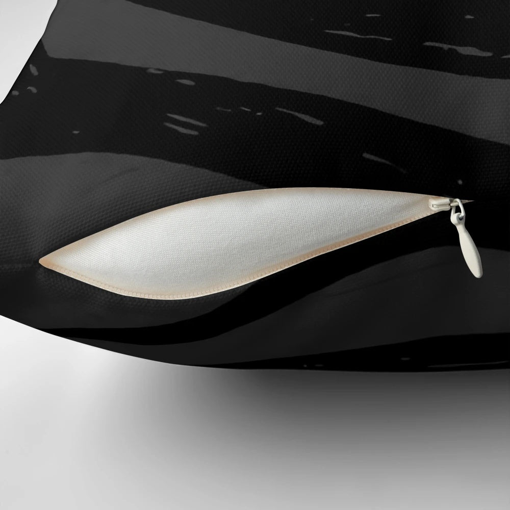 A black and white pillow featuring a gothic, minimalist design inspired by the films of Tim Burton