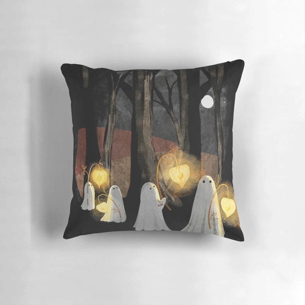 A glowing ghost parade pillow in a spooky forest landscape, perfect for adding a touch of Halloween ambiance.