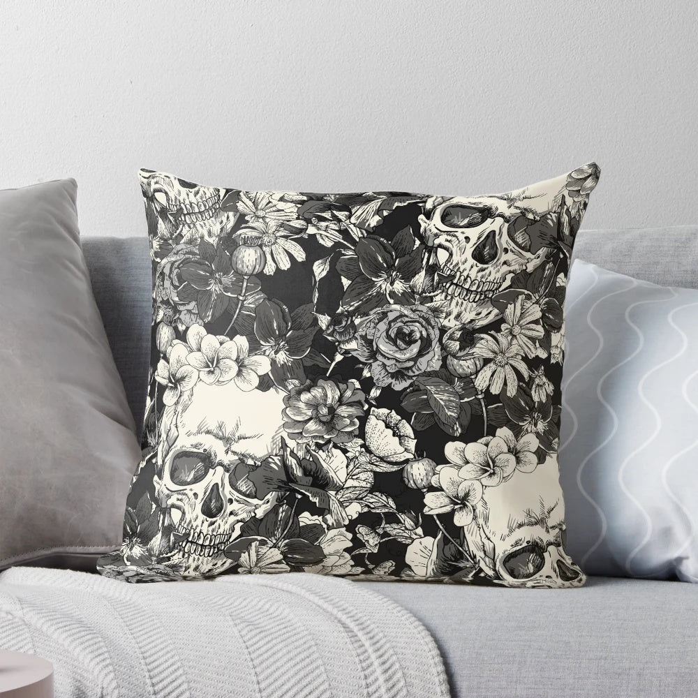 A black and white pillow with a striking skull design, perfect for gothic or Halloween-themed home decor.