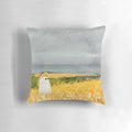 Pillow with a ghostly figure in a picturesque wheat field landscape