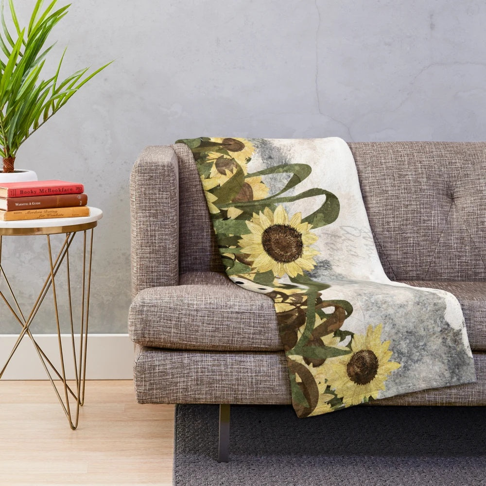 Plush blanket with a ghostly sunflower field design