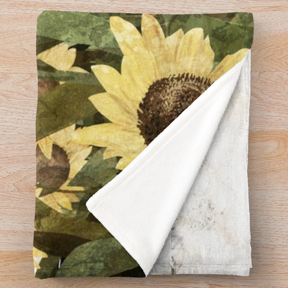 Plush blanket with a ghostly sunflower field design