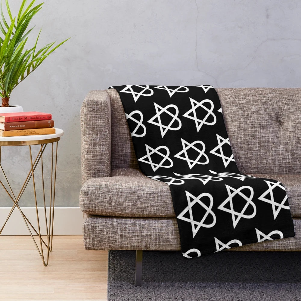 Heartagram plush blanket with a white and black design