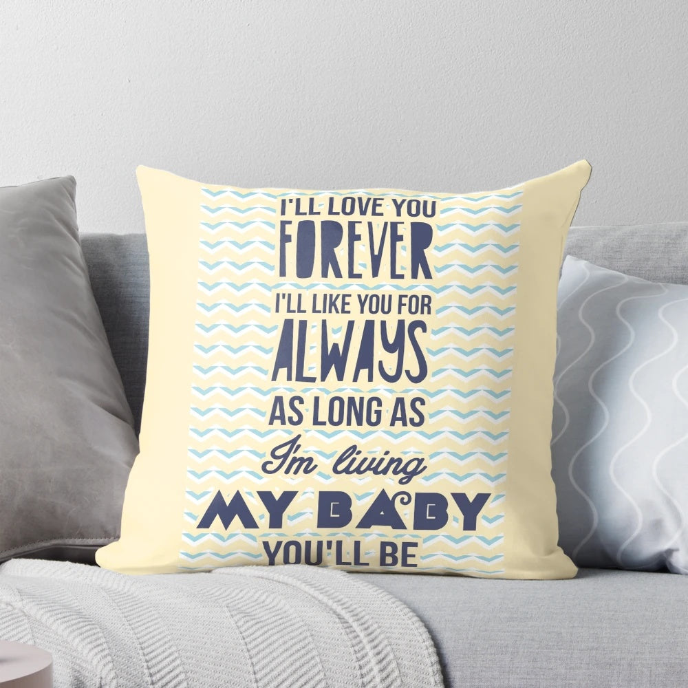 Soft, plush pillow featuring the quote "I'll love you forever, I'll like you for always as long as I'm living my baby you'll be" in a stylish design for a baby's nursery or child's room.
