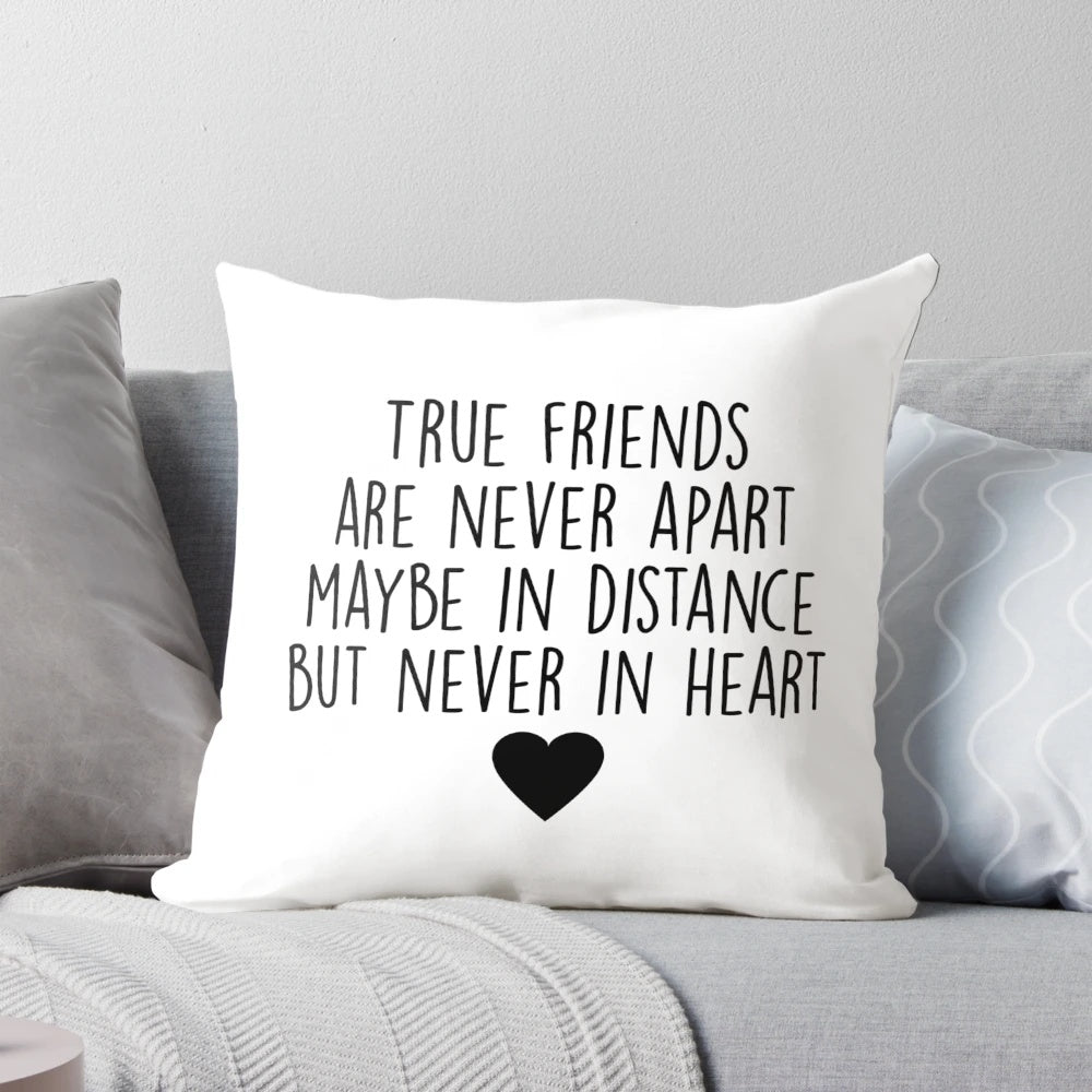 Pillow with calligraphic "True friends are never apart" design and heart accents