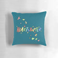 Colorful Heartstopper pillow featuring characters Charlie and Nick in a loving embrace, perfect for LGBTQ home decor