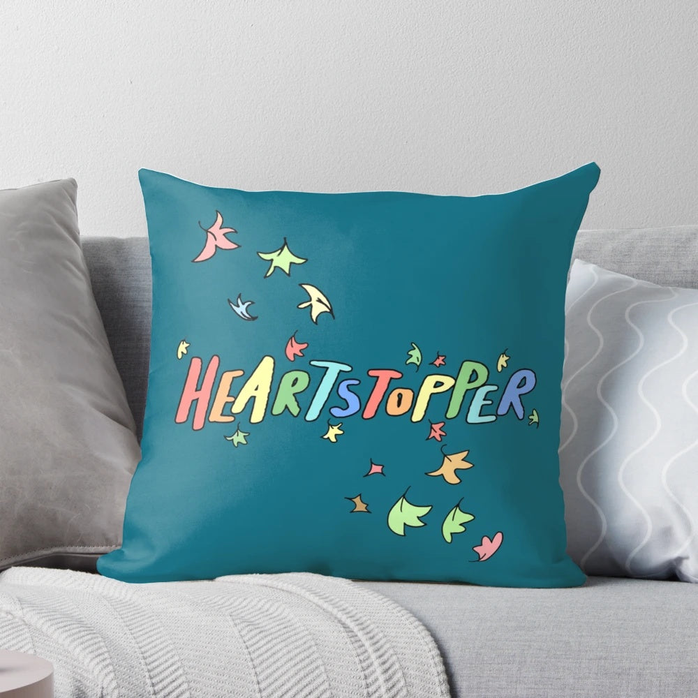 Colorful Heartstopper pillow featuring characters Charlie and Nick in a loving embrace, perfect for LGBTQ home decor