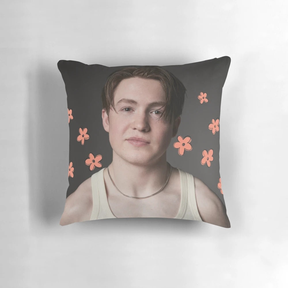 A cozy and stylish Heartstopper inspired pillow featuring Kit Connor's character Nick Nelson with a floral design.