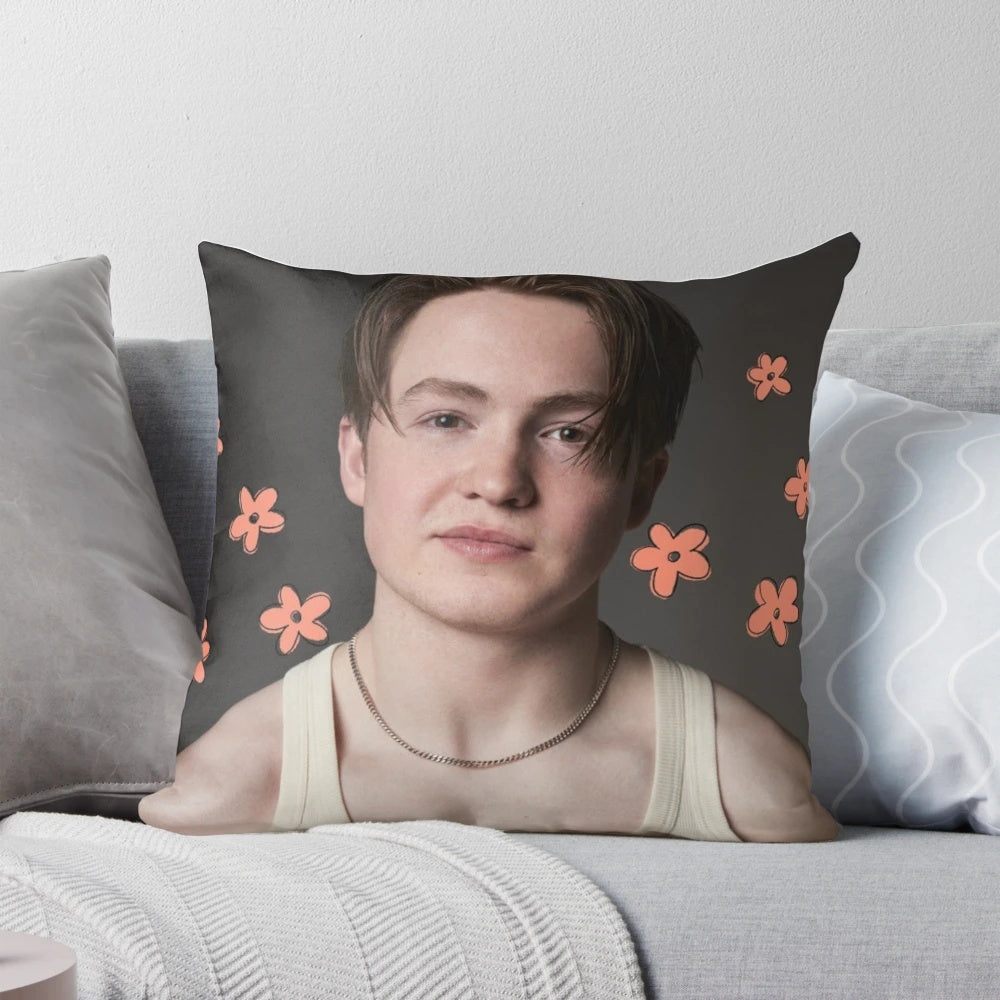 A cozy and stylish Heartstopper inspired pillow featuring Kit Connor's character Nick Nelson with a floral design.