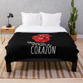 Soft and cozy heart-shaped plush blanket with a sunrise design