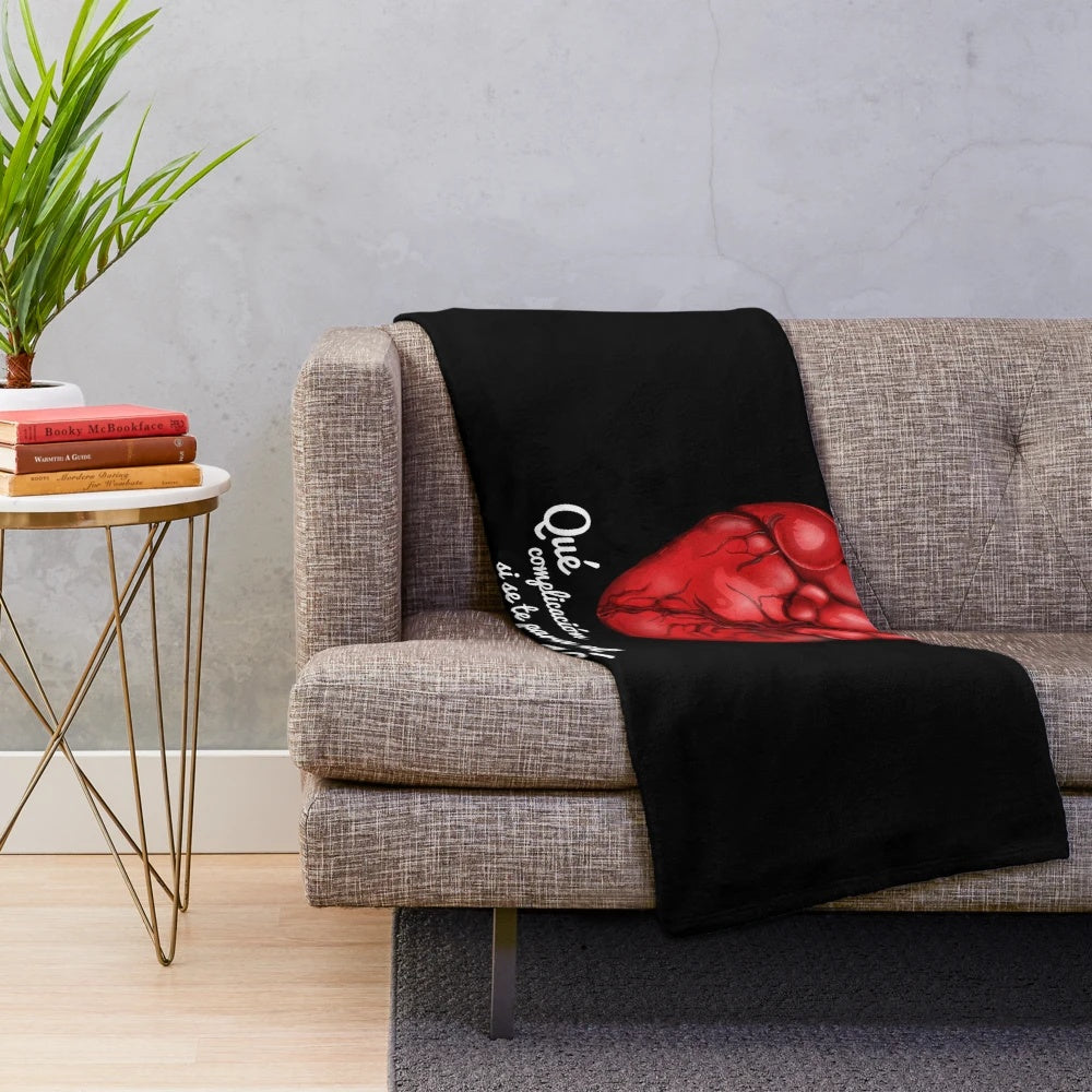 Soft and cozy heart-shaped plush blanket with a sunrise design