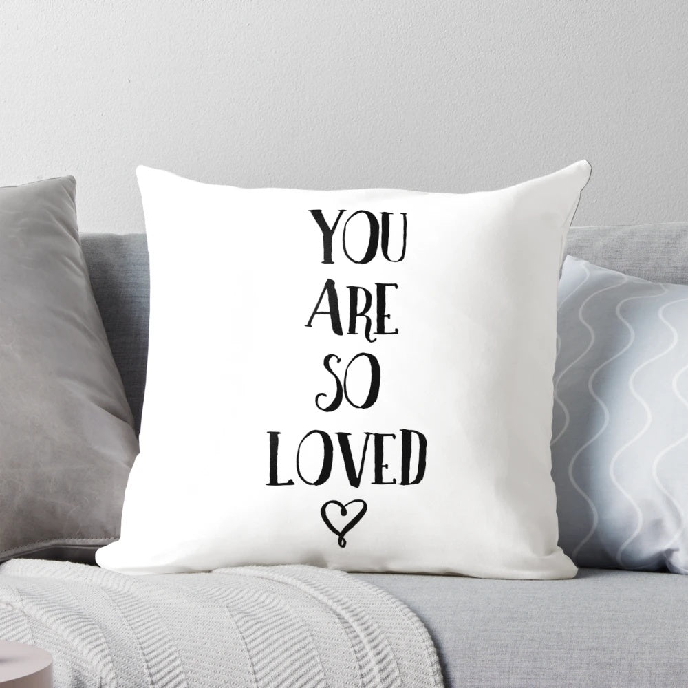 Soft, plush pillow featuring a hand-lettered "You Are So Loved" typography quote design