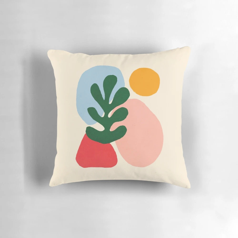 Vibrant throw pillow featuring wildlife motifs in the iconic cut-out style of French artist Henri Matisse