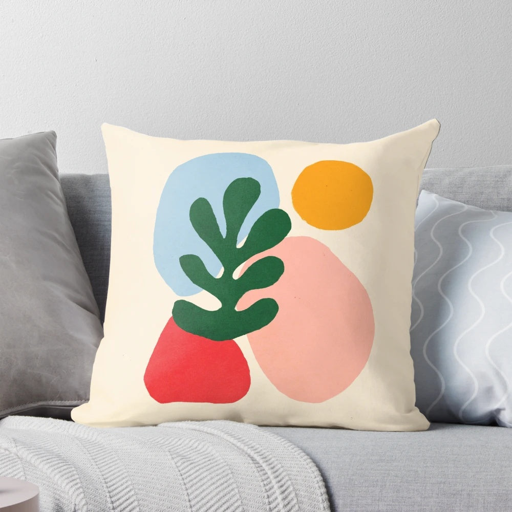 Vibrant throw pillow featuring wildlife motifs in the iconic cut-out style of French artist Henri Matisse