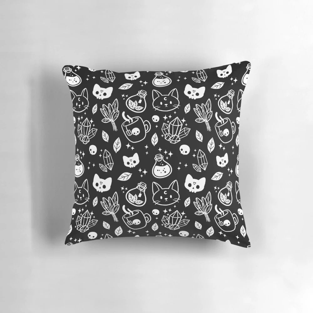 Herb witch design in black and white on a decorative pillow