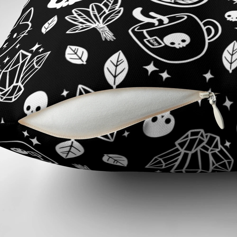 Herb witch design in black and white on a decorative pillow