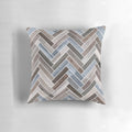 Herringbone pattern neutral color accent pillow in shades of blue, brown, and grey