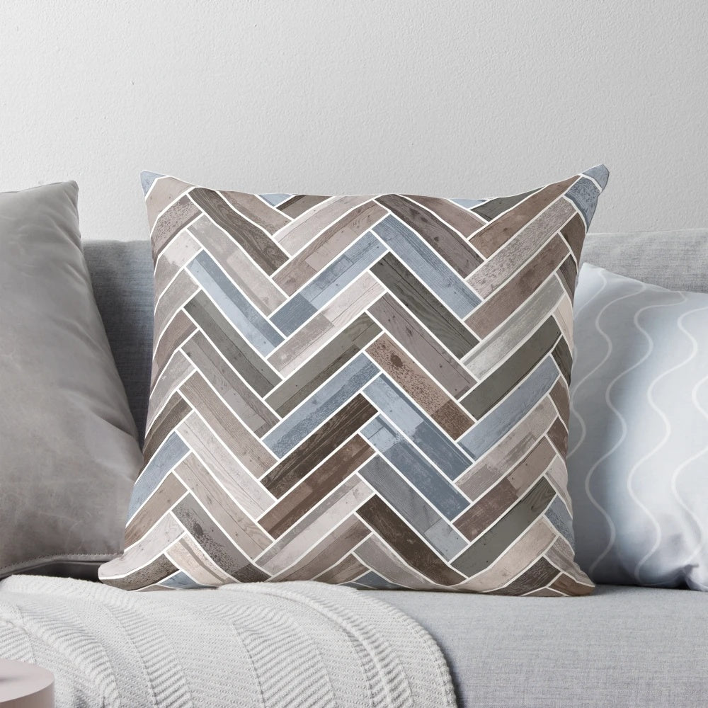 Herringbone pattern neutral color accent pillow in shades of blue, brown, and grey