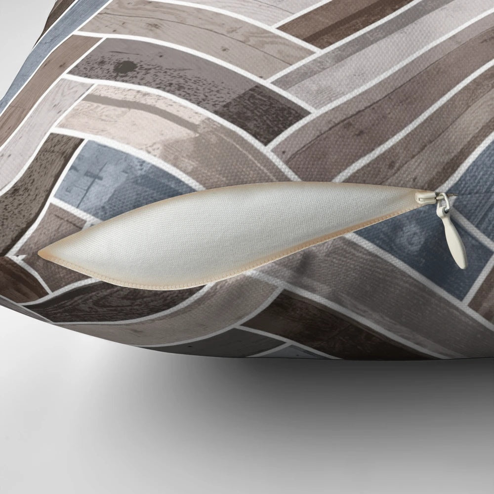 Herringbone pattern neutral color accent pillow in shades of blue, brown, and grey