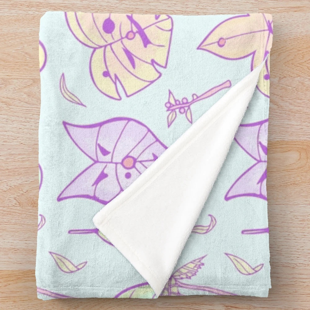Blue plush Zelda-inspired blanket featuring Hestu the Korok character
