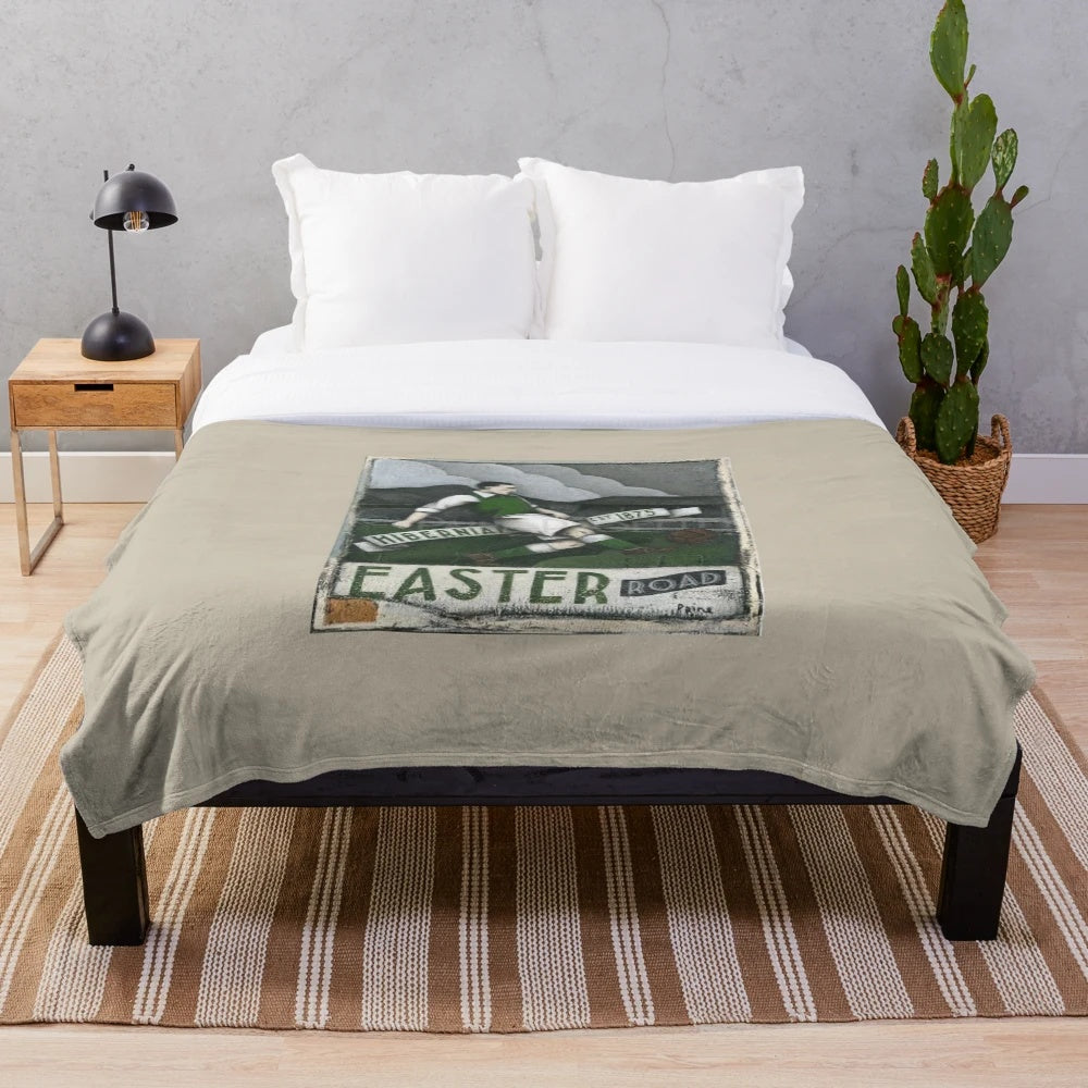 Hibernian FC-inspired plush blanket with the club's colors and logo