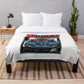 Blue German sports car with open hood on plush blanket