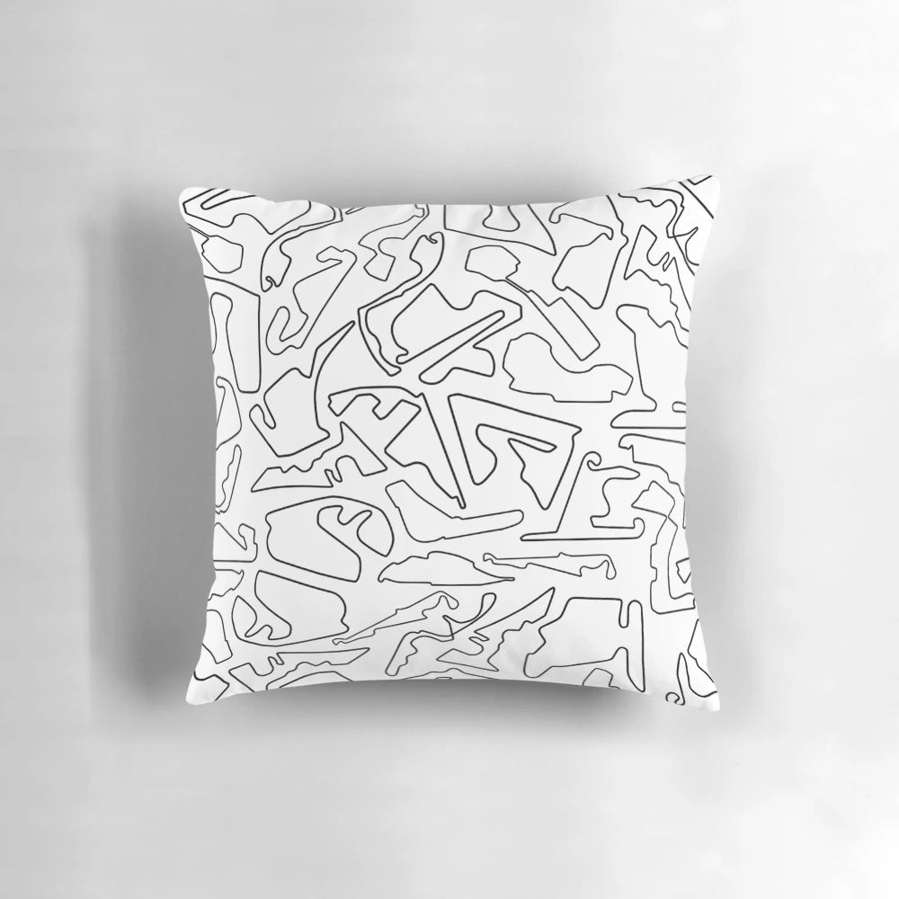 High-quality pillow featuring a design of race tracks against a white background, perfect for motorsports enthusiasts.