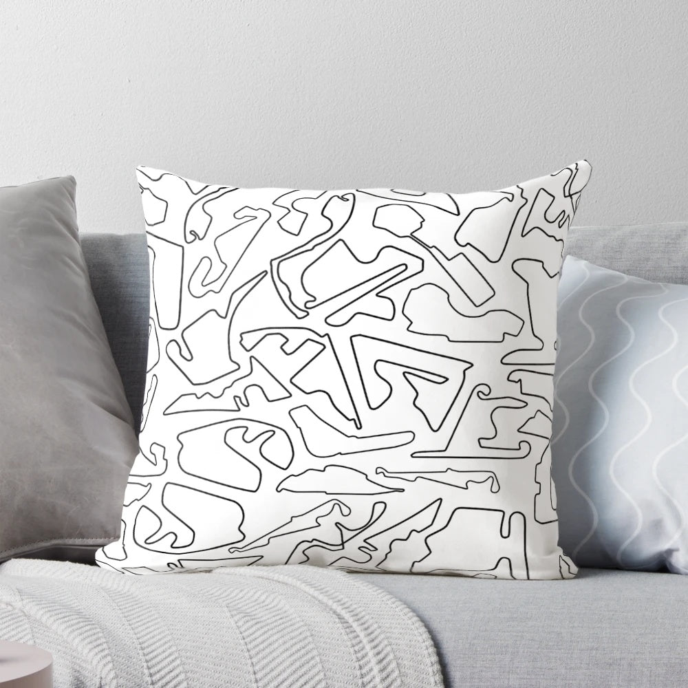 High-quality pillow featuring a design of race tracks against a white background, perfect for motorsports enthusiasts.