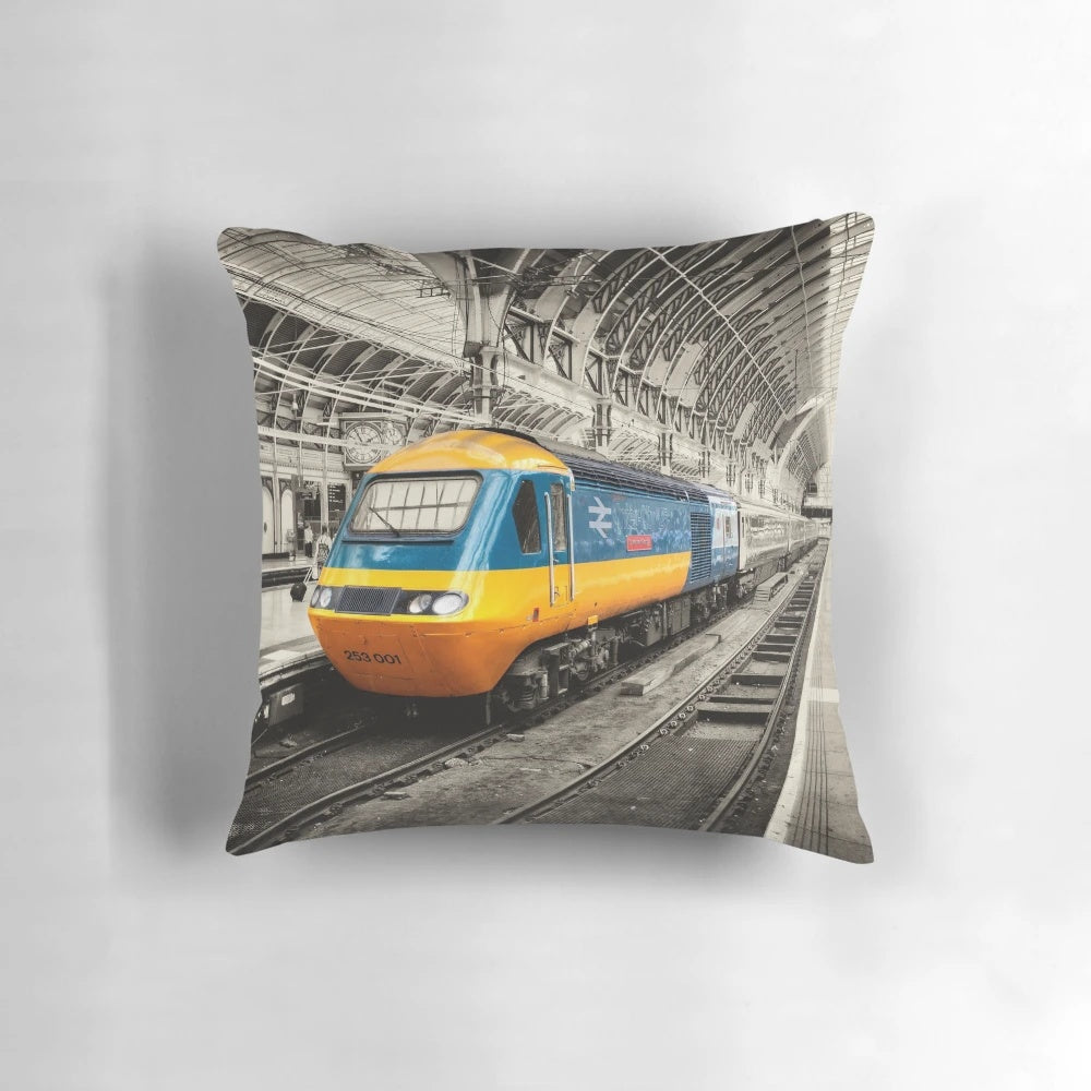 Padded pillow featuring the Paddington station logo and colors, perfect for comfortable high-speed train journeys.