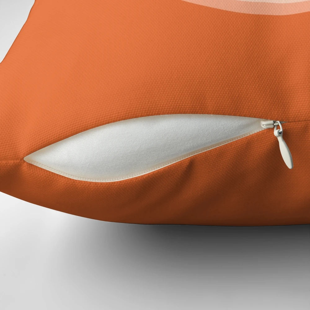 Orange and white baked beans farting pillow with a playful, silly design.