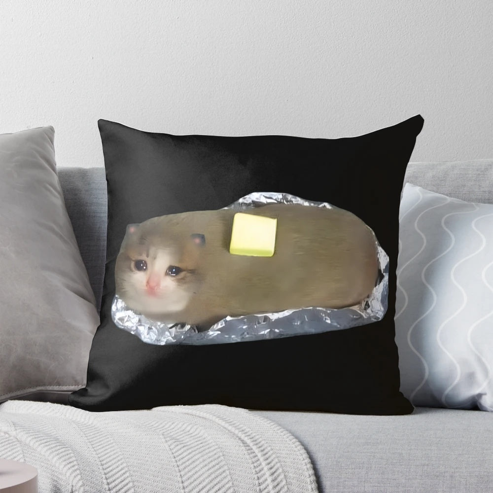 Decorative pillow featuring a meme of a sad, crying cat with a baked potato
