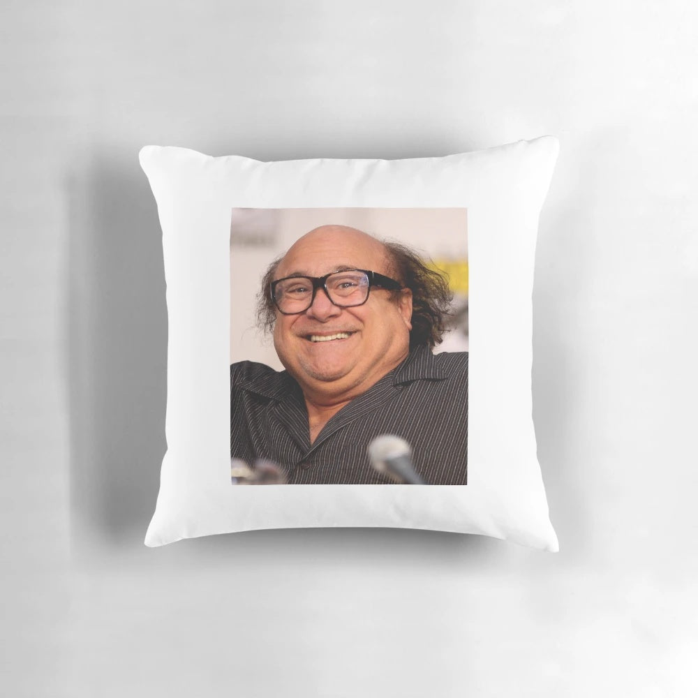 Danny DeVito meme printed on a soft, plush pillow for a touch of dark humor in your home decor.