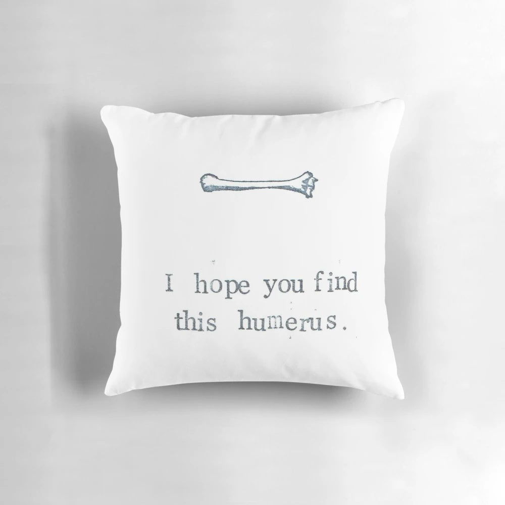 A soft and plush pillow featuring a humorous design of the humerus bone, perfect for medical students, doctors, and anatomy enthusiasts.
