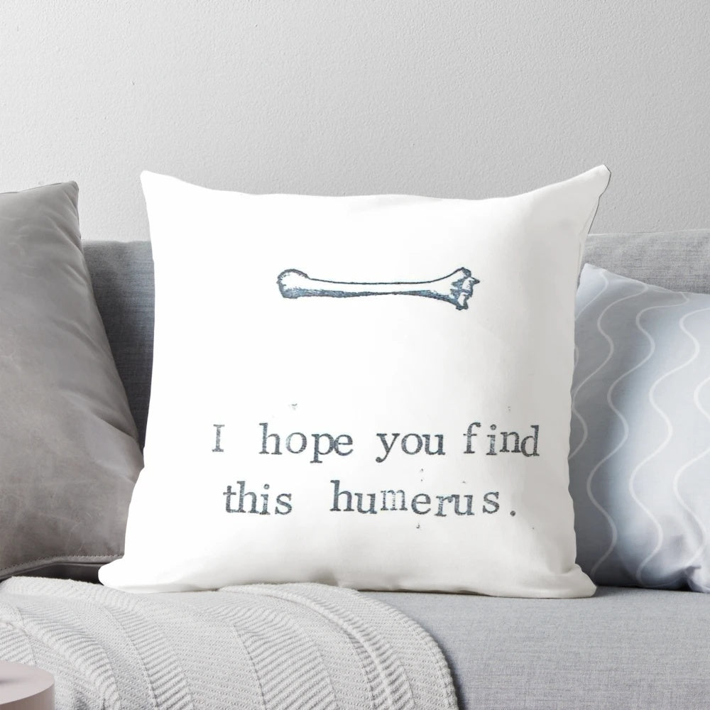 A soft and plush pillow featuring a humorous design of the humerus bone, perfect for medical students, doctors, and anatomy enthusiasts.