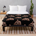 Funny meme plush blanket featuring a large black man sitting on a bed