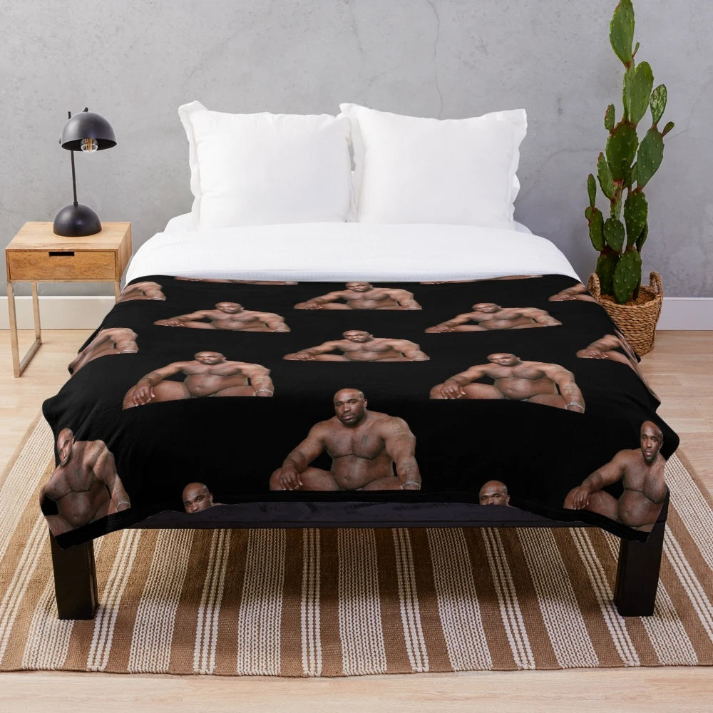 Funny meme plush blanket featuring a large black man sitting on a bed