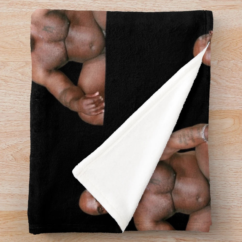 Funny meme plush blanket featuring a large black man sitting on a bed