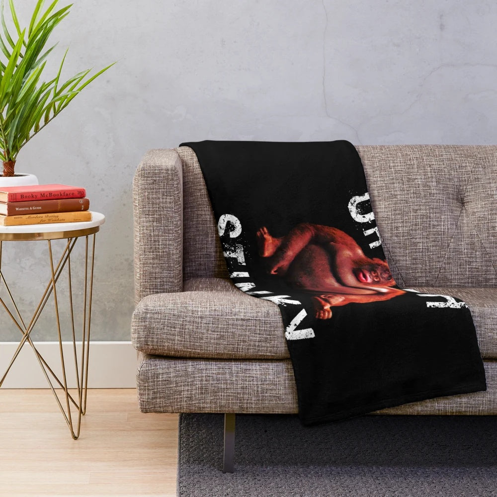Monke meme-inspired plush blanket featuring humorous "Uh oh, stinky" design