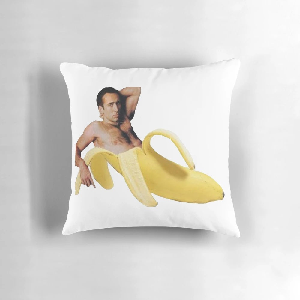 Playful Nicholas Cage-themed decorative pillow with a "sexy banana pose" design
