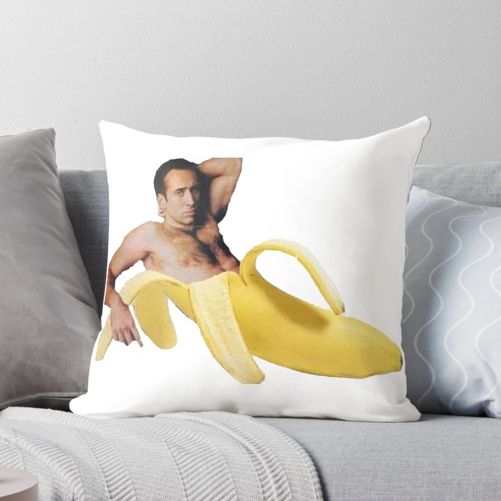 Playful Nicholas Cage-themed decorative pillow with a "sexy banana pose" design