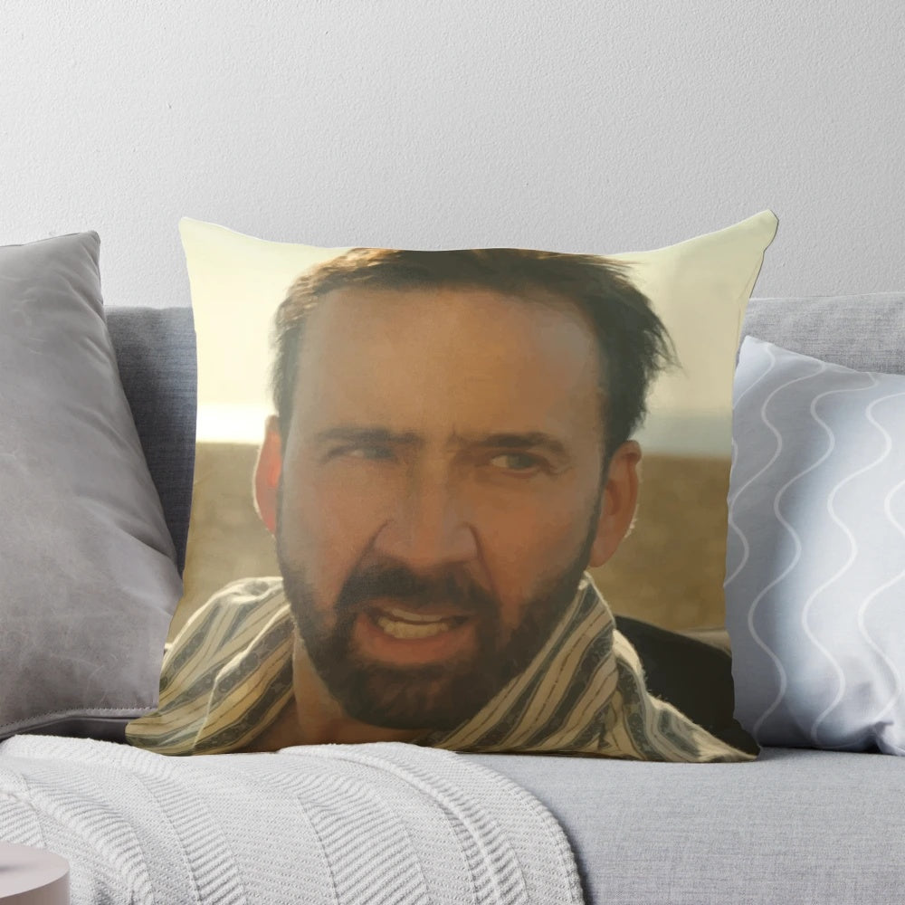 A plush pillow featuring a smiling, meme-worthy image of actor Nicolas Cage.
